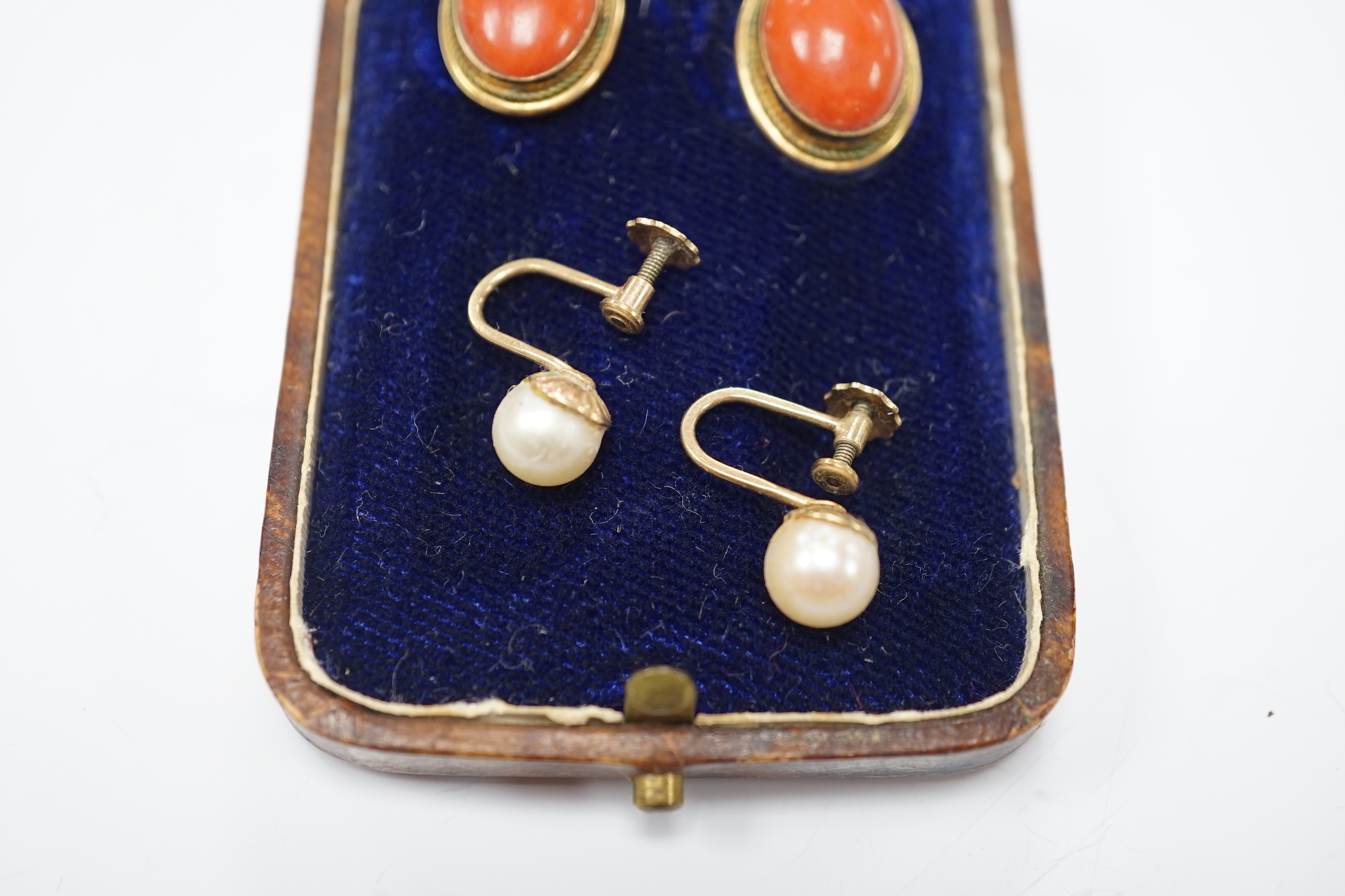 A pair of 750 yellow metal and cabochon coral set ear clips, 16mm and a pair of 9ct and single stone cultured pearl set ear clips.